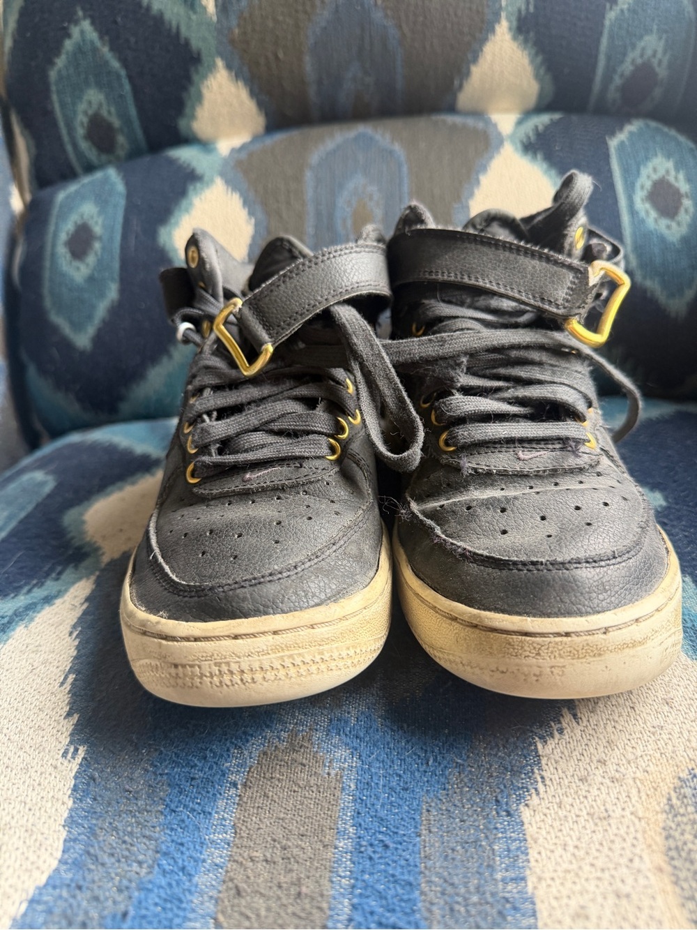 Nike Kids Black Sneakers with Gold Eyelets